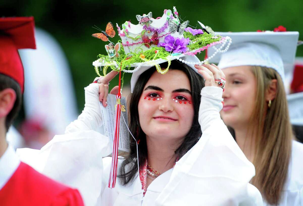 Danny Newman adjusts her cap as she waits to get her diploma during Greenwich High School’s Class of 2022 commencement ceremony on Thursday.