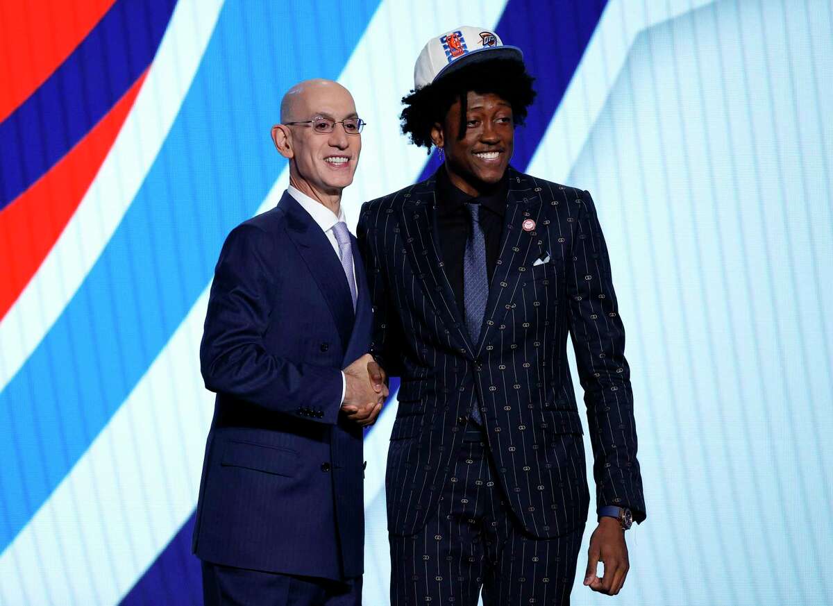 NEW YORK, NEW YORK - JUNE 23: NBA commissioner Adam Silver (L) and Jalen Williams pose for photos after Williams was drafted with the 12th overall pick by the Oklahoma City Thunder during the 2022 NBA Draft at Barclays Center on June 23, 2022 in New York City. NOTE TO USER: User expressly acknowledges and agrees that, by downloading and or using this photograph, User is consenting to the terms and conditions of the Getty Images License Agreement. (Photo by Sarah Stier/Getty Images)