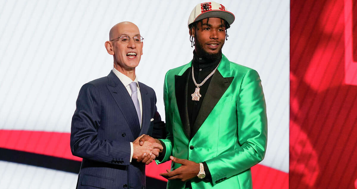 Tari Eason congratulates NBA commissioner Adam Silver after being selected 17th overall by the Houston Rockets in the NBA basketball draft on Thursday, June 23, 2022, in New York.