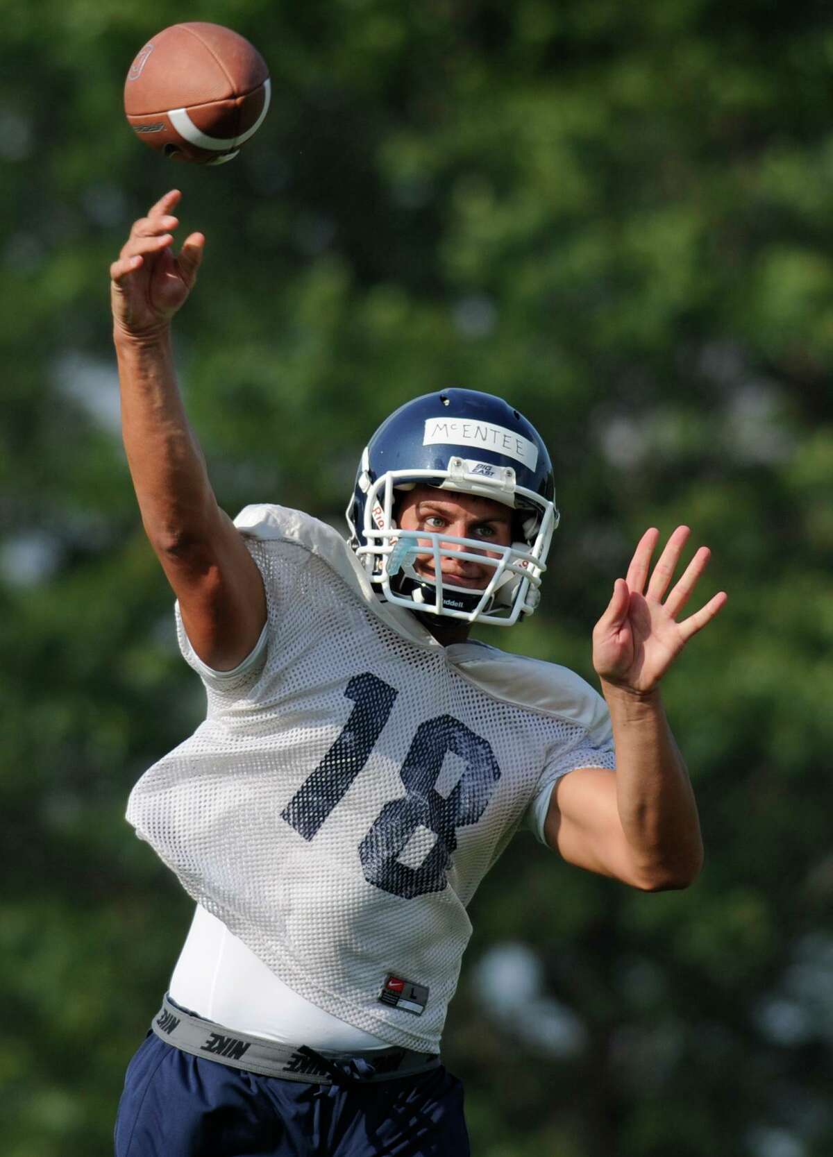 Connecticut quarterback Johnny McEntee throws during the first NCAA college football practice of the season at the University of Connecticut in Storrs, Conn., Friday, Aug. 5, 2011. McEntee, a former White house official, was seen briefly in the House Jan. 6 committee hearing Thursday.