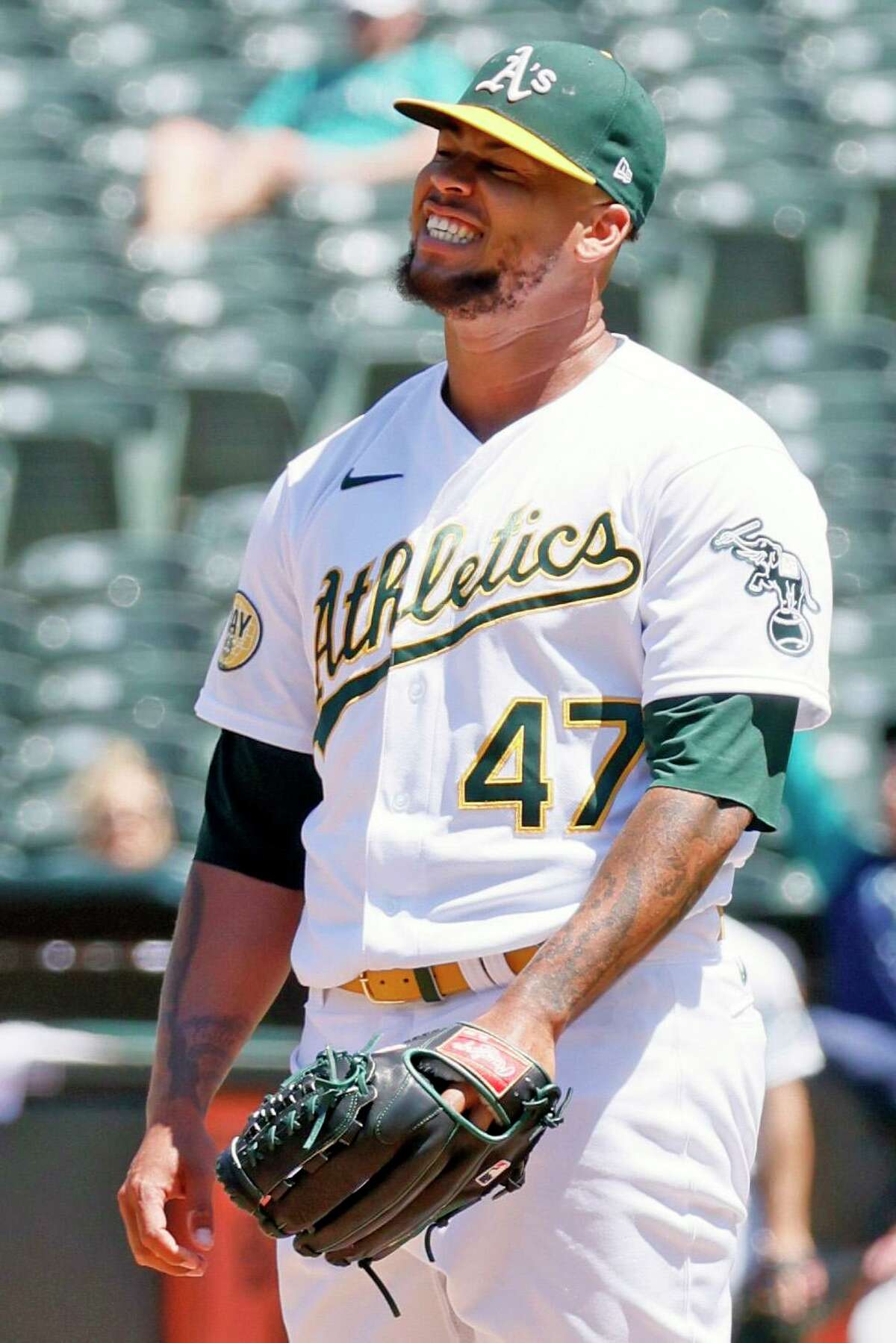 Oakland Athletics starting pitcher Frankie Montas (47) reacts after giving up his first hit in the eighth inning during an MLB game against the Seattle Mariners at RingCentral Coliseum, Thursday, June 23, 2022, in Oakland, Calif.