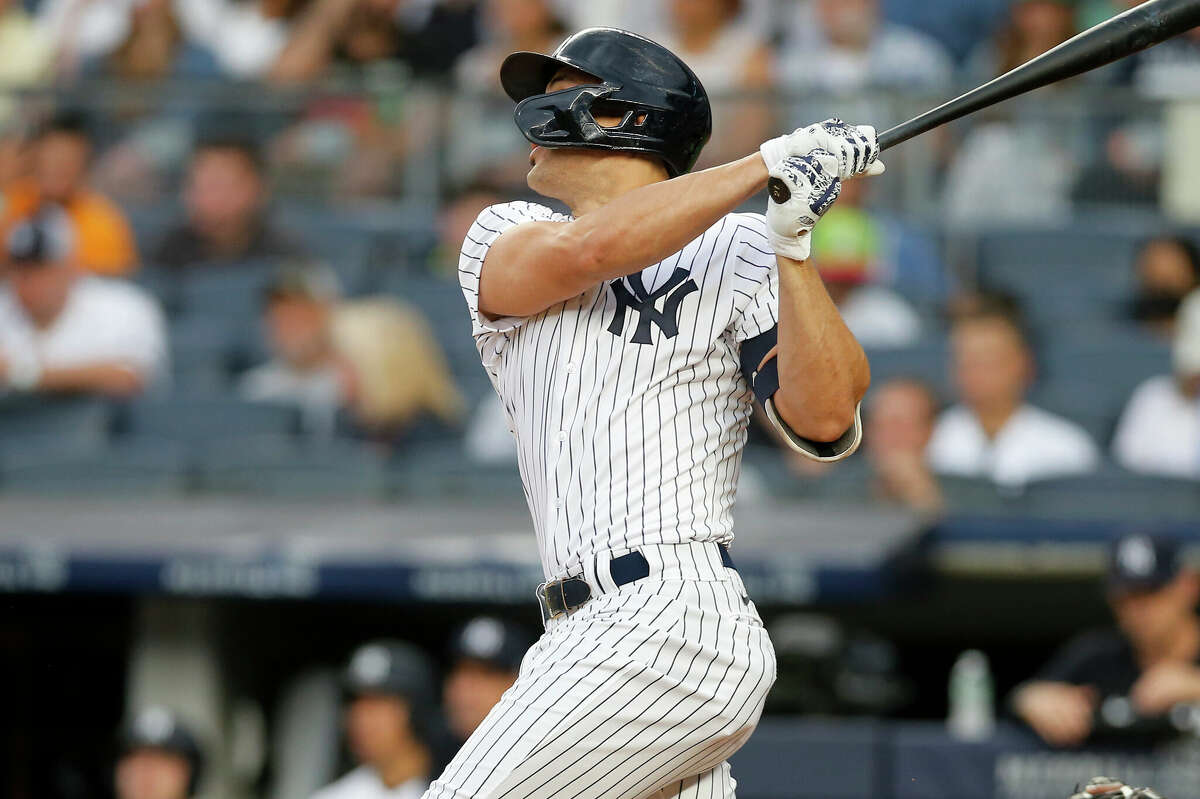 NEW YORK, NEW YORK - JUNE 23: Giancarlo Stanton #27 of the New York Yankees follows through on his first inning three run home run against the Houston Astros at Yankee Stadium on June 23, 2022 in New York City. (Photo by Jim McIsaac/Getty Images)
