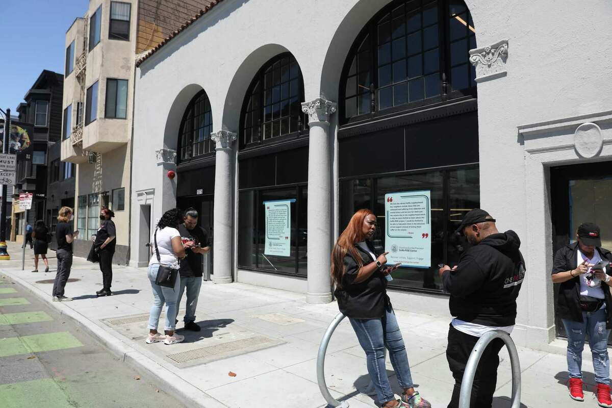 Staff members prepare for the opening of SoMa, San Francisco’s first drug sobering center, which will operate out of a former office building on Howard Street.