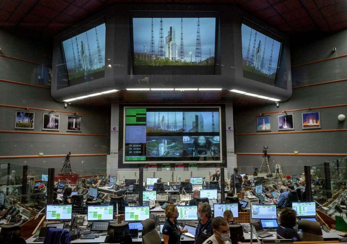 Launch teams monitor the countdown to the launch of Arianespace's Ariane 5 rocket carrying NASA's James Webb Space Telescope, Dec. 25, 2021, in the Jupiter Center at the Guiana Space Center in Kourou, French Guiana.