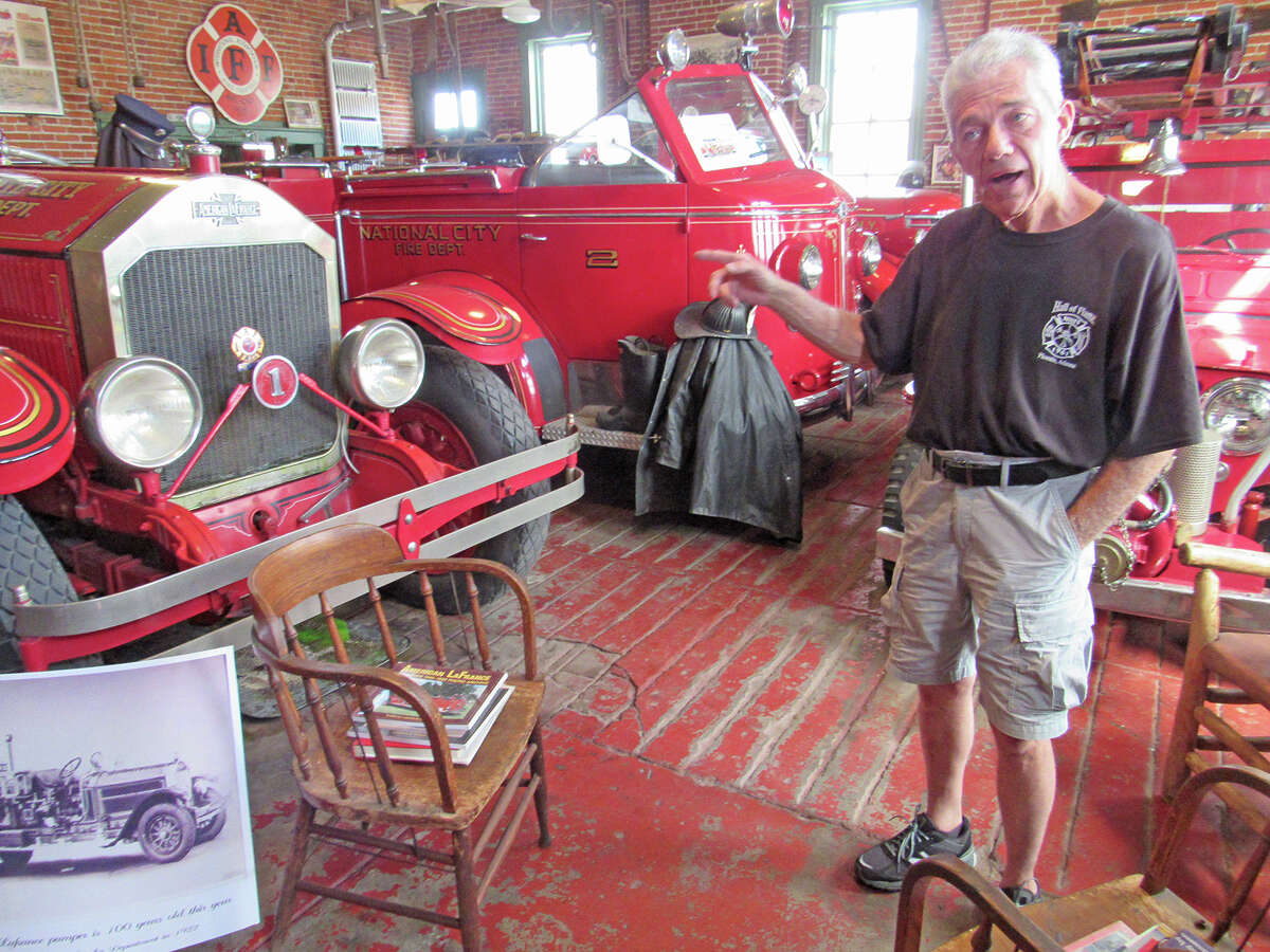 Larry Zotti, who is the unofficial curator of the Granite City Fire Museum, points to his “pride and joy,” a 1922 firetruck that was originally owned by the Granite City Fire Department. Zotti was able to find the truck in 1987, and he and his father spent four and a half years restoring it.