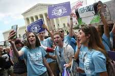 Pro-life supporters celebrate outside the U.S. Supreme Court on June 24, 2022.