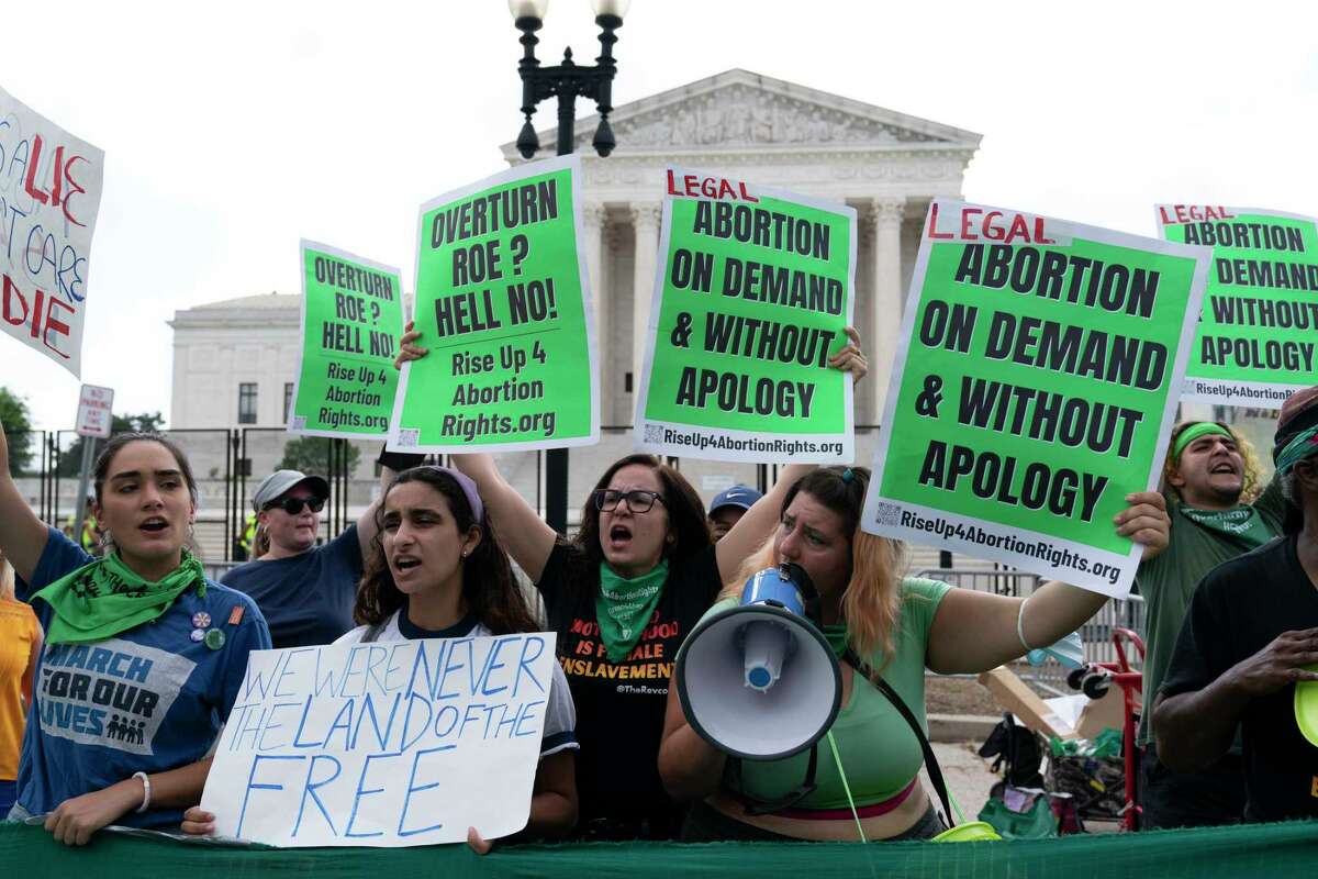 abortion-rights activists gather outside the Supreme Court in Washington, Friday, June 24, 2022. The Supreme Court has ended constitutional protections for abortion that had been in place nearly 50 years, a decision by its conservative majority to overturn the court's landmark abortion cases. (AP Photo/Jose Luis Magana)