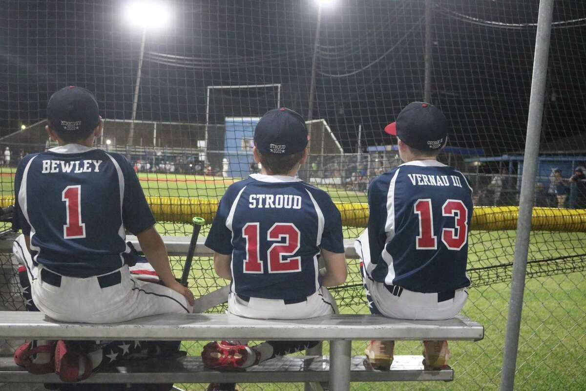 From L-R, the NASA 12s all-star trio of McKelvey Bewley, Tyler Stroud and George Vernau III watch the League City-Bayside contest after NASA eliminated Baytown 12-4 Thursday night.