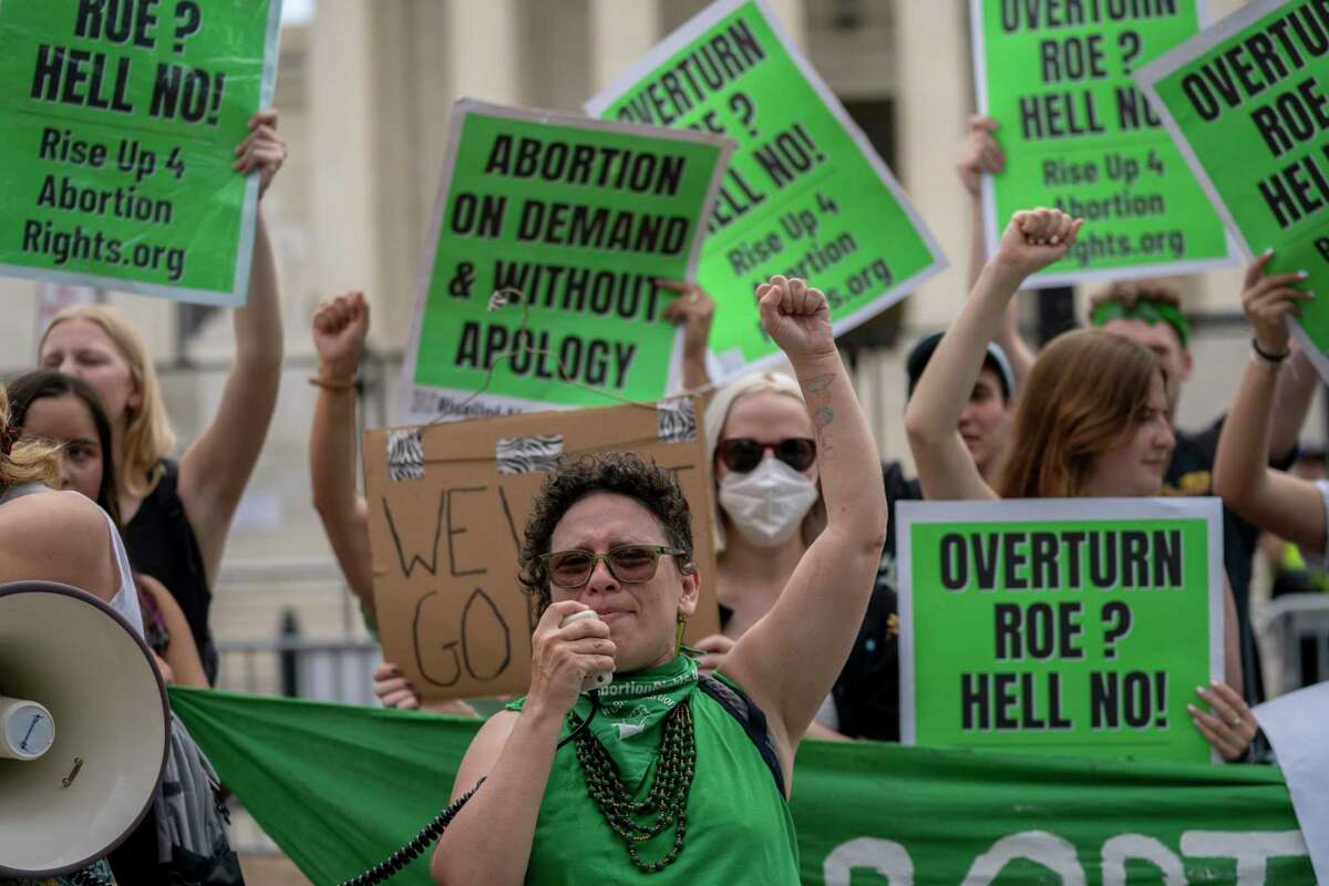 Abortion-rights protesters regroup and protest following Supreme Court's decision to overturn Roe v. Wade, federally protected right to abortion, in Washington, Friday, June 24, 2022. The Supreme Court has ended constitutional protections for abortion that had been in place nearly 50 years, a decision by its conservative majority to overturn the court's landmark abortion cases. (AP Photo/Gemunu Amarasinghe)
