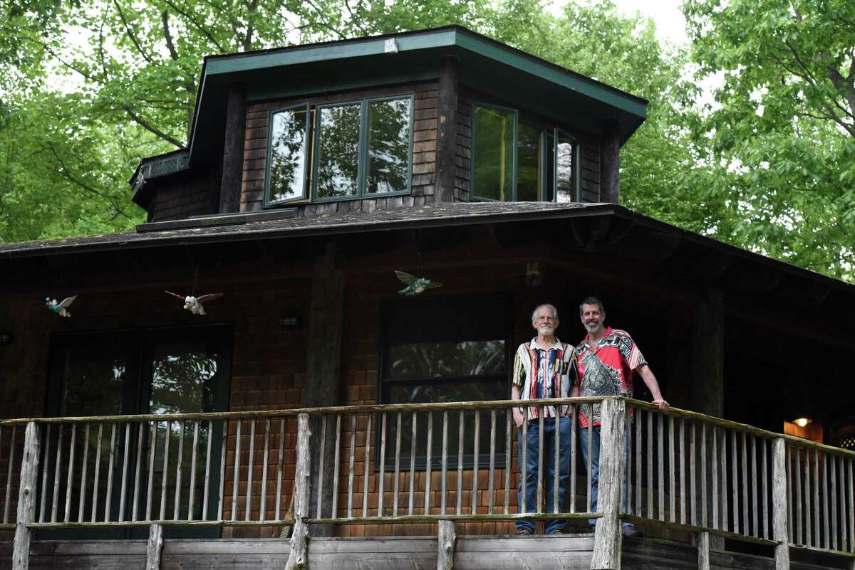 John Sowle, left, and Steven Patterson on the deck of their hexagonal home on Thursday, May 26, 2022, in Catskill, N.Y. Sowle and Patterson founded Bridge Street Theatre.