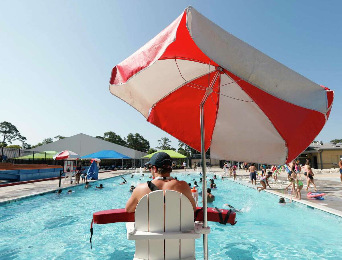 A life guard watches swimmers as temperatures creep up into the high 90s as more than 150 youth from around Montgomery County took part in this year’s World's Largest Swimming Lesson at the City of Conroe Water Park, Friday, June 24, 2022, in Conroe.