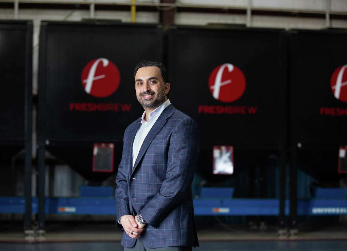 Fresh Brew Group Al Ansari poses for a photograph at the roasting facility Wednesday, June 8, 2022, in Houston.
