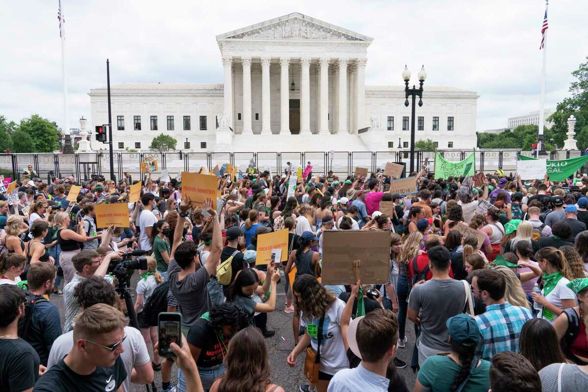 Protesters gather outside the Supreme Court in Washington, Friday, June 24, 2022. The Supreme Court has ended constitutional protections for abortion that had been in place nearly 50 years, a decision by its conservative majority to overturn the court's landmark abortion cases.