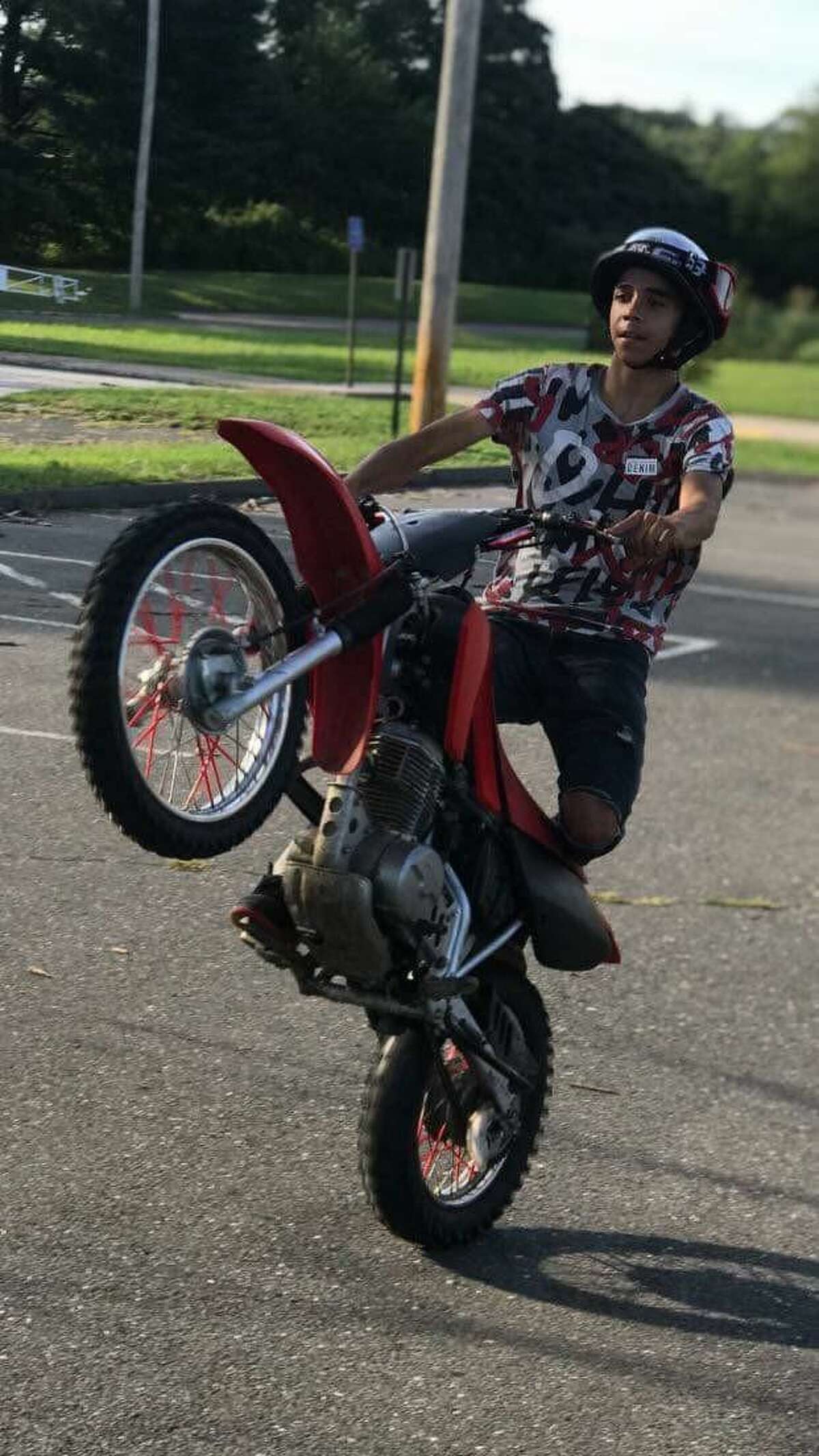 In this undated photo, Adolfo “AJ” DeJesus rides a scooter. DeJesus, 17, and an 18-year-old were hospitalized after a pickup truck struck the scooter they were riding on Kossuth Street on June 15. DeJesus was seriously injured and died days later, his family said.