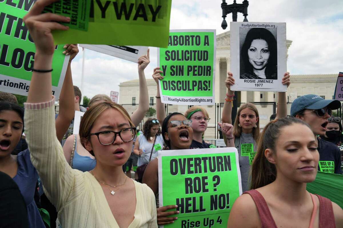 Abortion rights advocates gather to protest outside the Supreme Court in Washington on Friday. The Supreme Court on Friday overruled Roe v. Wade, eliminating the constitutional right to abortion after almost 50 years.