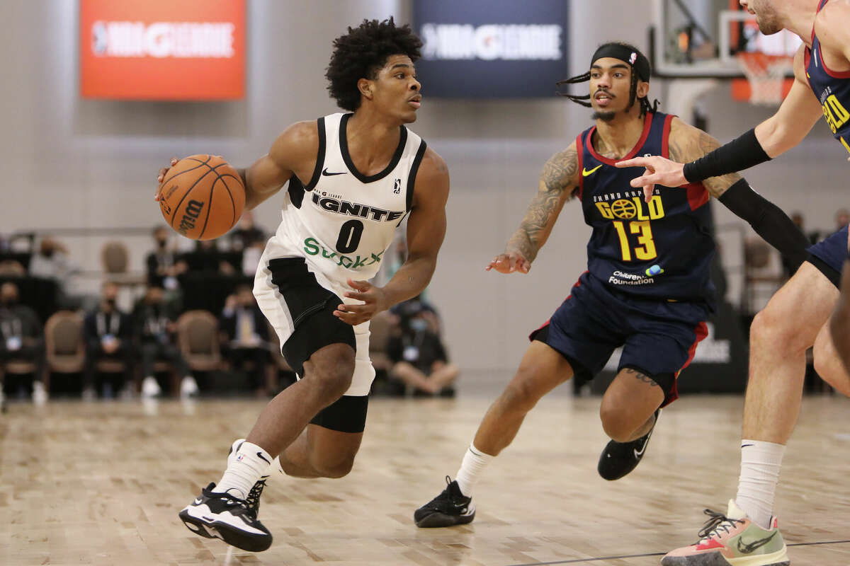 Grand Rapids Gold's Scoot Henderson #0 heads for the rim against Grand Rapids Gold's Manny Camper #13 during the NBA G League Winter Showcase at the Mandalay Bay Convention Center on December 19, 2021 in Las Vegas, Nevada.