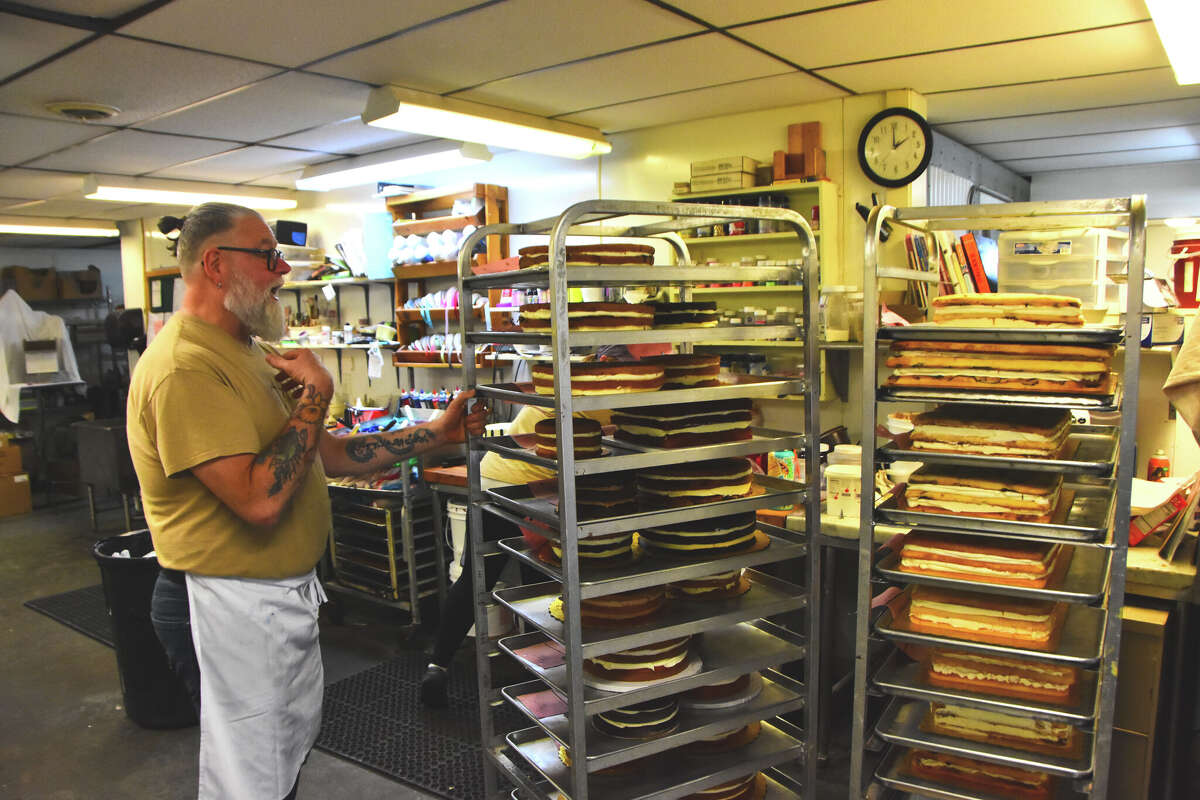Working with two assistants in the basement production kitchen of Zachary's Pastry Shoppe in East Greenbush, owner Dan Raymond is filling more than 100 orders for wedding, graduation parties and other events this weekend, when such celebrations are in full swing for the first time in three years.