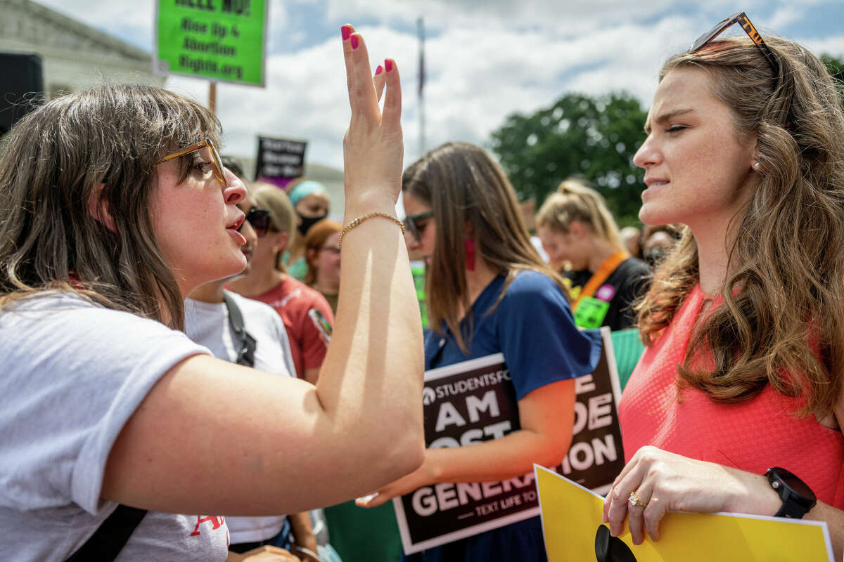 People argue following the Dobbs v Jackson Women's Health Organization ruling in front of the U.S. Supreme Court on June 24, 2022 in Washington, DC.