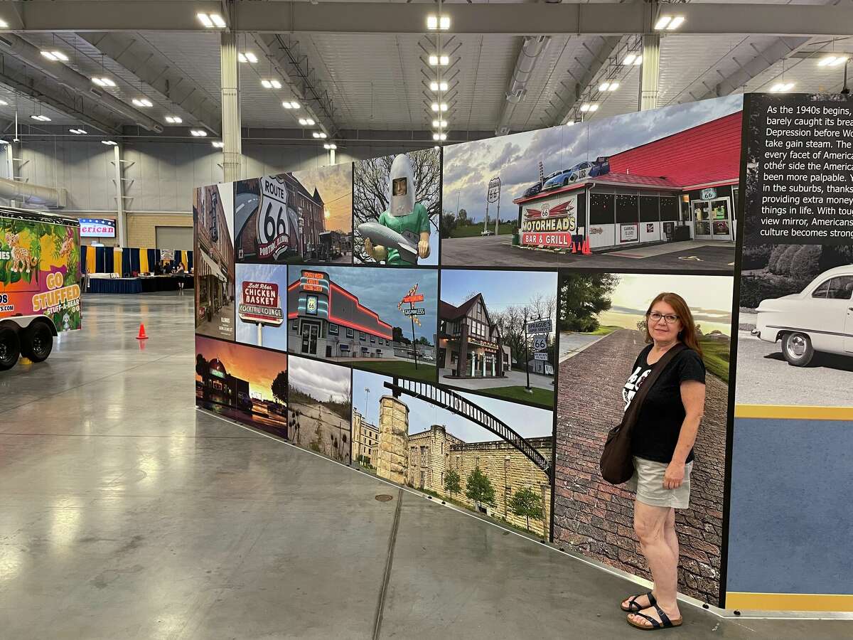 Edwardsville historian, author and photographer Cheryl Eichar Jett stands beside her panel featuring her photographs of Route 66 Illinois attractions at the AAA-sponsored Route 66 Road Fest last weekend in Oklahoma City.