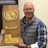 Westport’s Dave Goldshore, shown holding Michigan’s 1989 NCAA Tournament men’s basketball trophy, has been named the new head coach for Staples boys basketball after five years as an assistant for former coach Colin Devine. Goldshore is a Michigan alum.