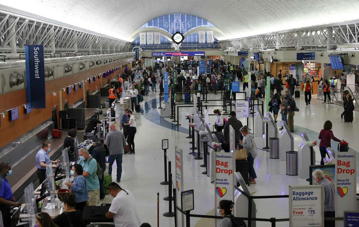 An Express-News photo of a crowded San Antonio International Airport. 