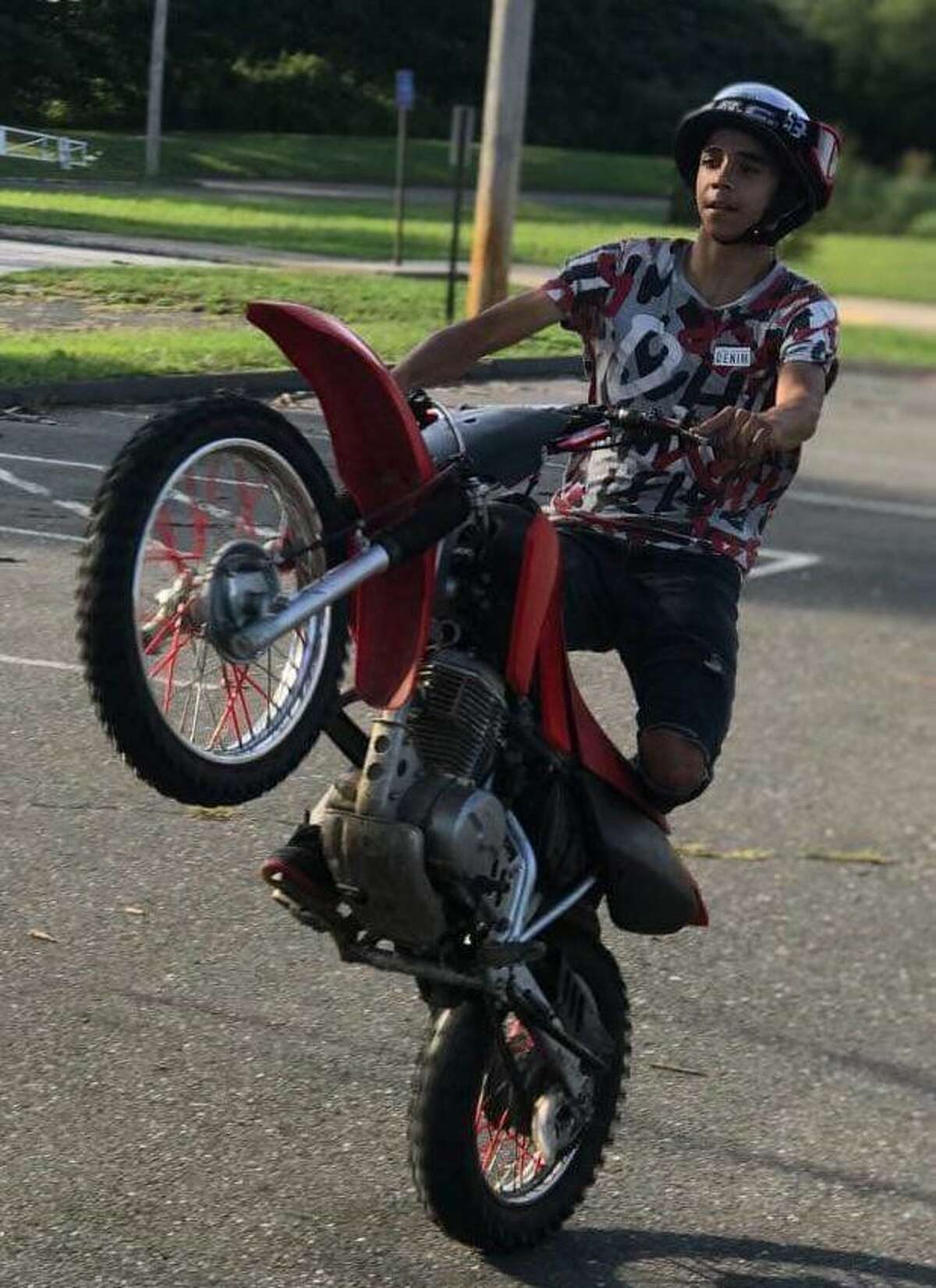 In this undated photo, Adolfo “AJ” DeJesus rides a scooter. DeJesus, 17, of Bridgeport, and a 16-year-old were hospitalized after a pickup truck struck the scooter they were riding on Kossuth Street on June 15. DeJesus was seriously injured and died days later, his family said.