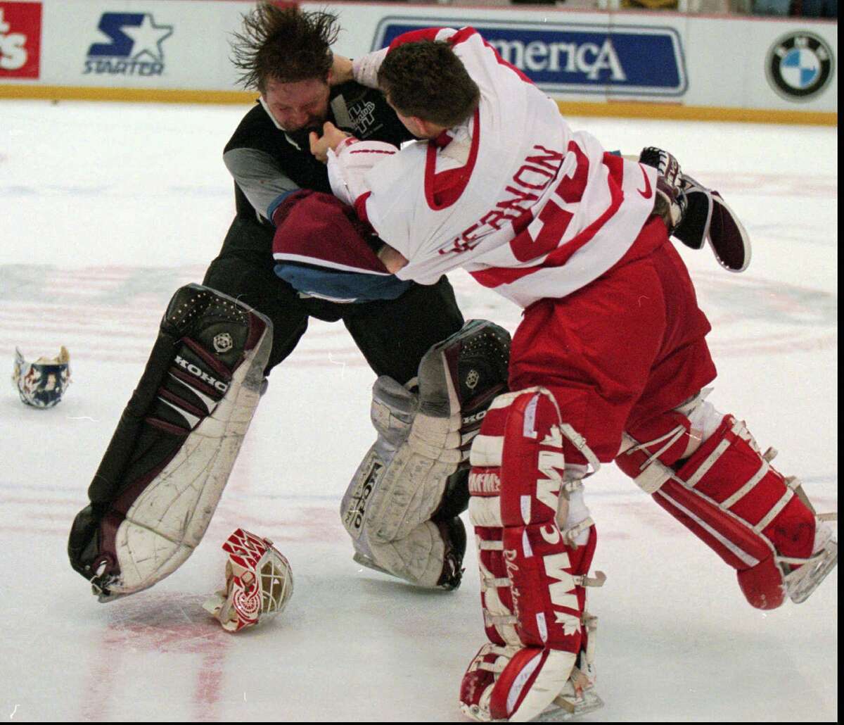 Detroit goaltender Mike Vernon and Colorado counterpart Patrick Roy slug it out during a March 1997 game. The Red Wings-Avalanche rivalry of the late 1990s is the subject of a new ESPN film "Unrivaled" that premieres Sunday afternoon.