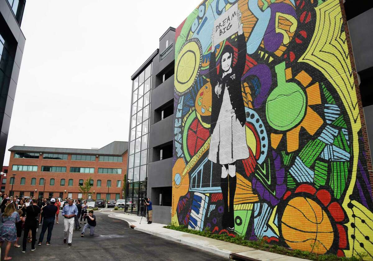 The "Dream Big" mural by Connecticut artist Patrick Ganino is unveiled at The Village in Stamford, Conn. Thursday, July 8, 2021. Ganino is one of several artists who will be featuring during a West Side art fest slated for July.