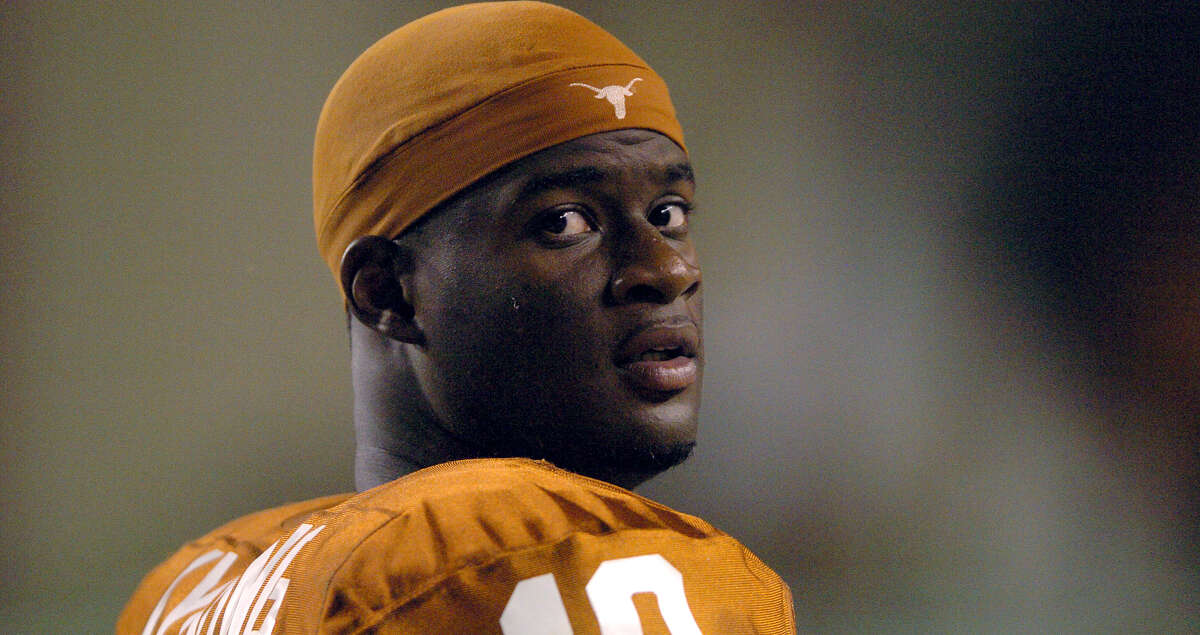UT quarterback Vince Young waits on the sideline after being pulled from his team's rout of North Texas Saturday in Austin. Tom Reel/Staff September 4, 2004.