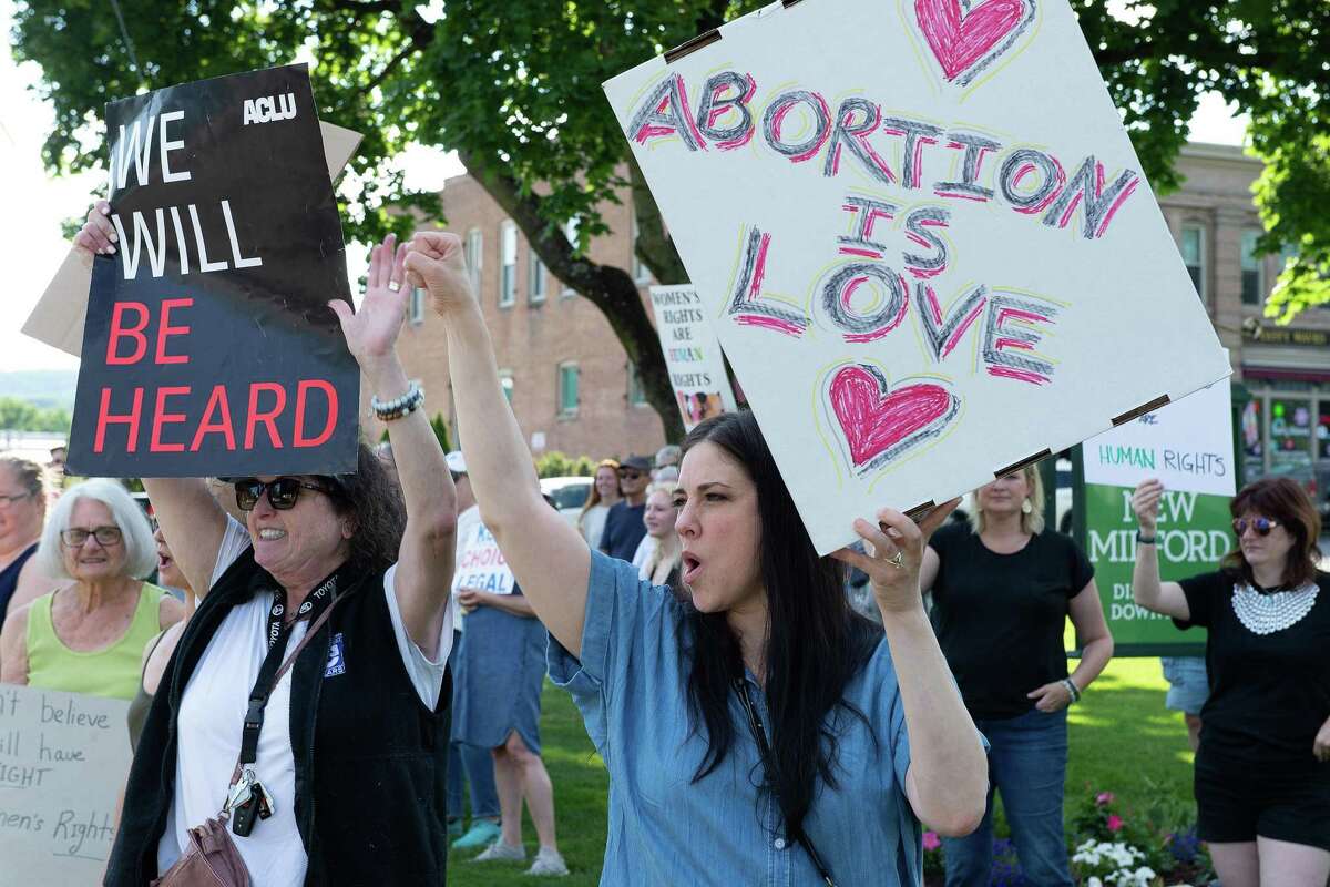 With signs and chants, New Milford rally protests Supreme Court