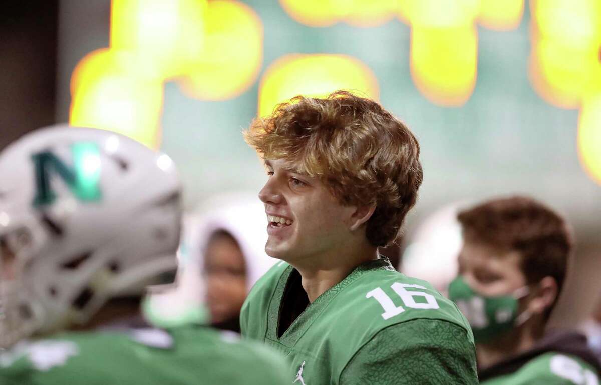 Newman High School quarterback Arch Manning (16) smiles on the sideline during a playoff game against Catholic High of New Iberia, in New Orleans, Friday, Dec. 4, 2020.