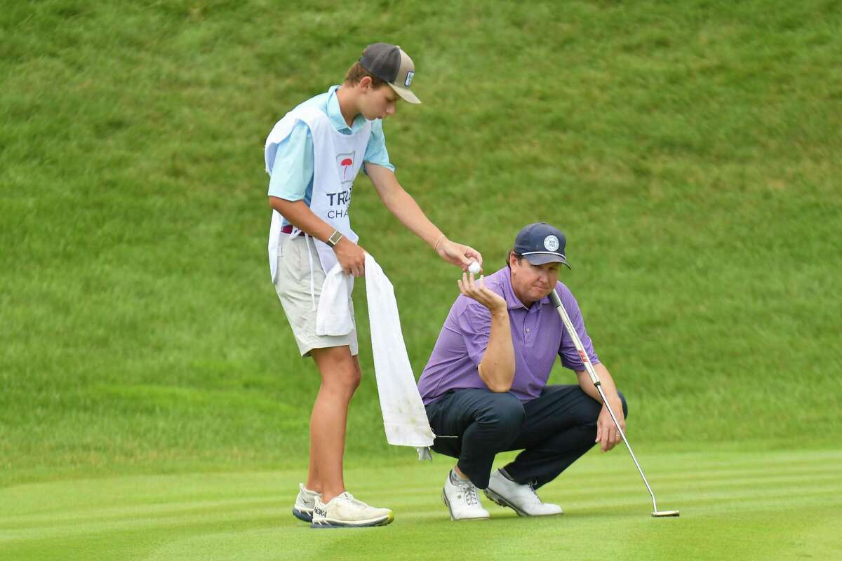 J.J. Henry, who grew up in Fairfield. competes in the second round of the Travelers Championship. His son, Connor, 17, is his caddy this week.