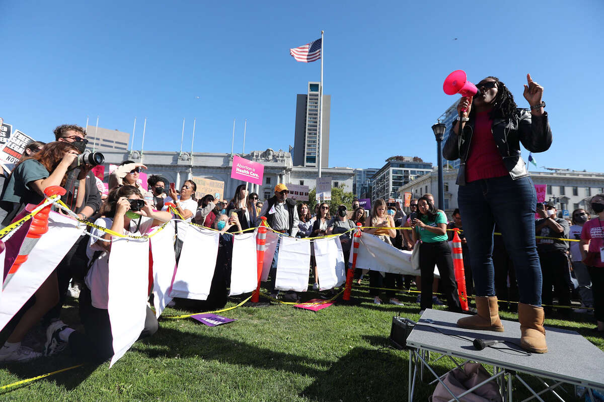 Kimberly Ellis, director of the San Francisco Department on the Status of Women, speaks to a crowd of protesters on Friday, June 24, at the Civic Center during a Planned Parenthood rally in the wake of the Supreme Court's ruling to overturn Roe v. Wade. 