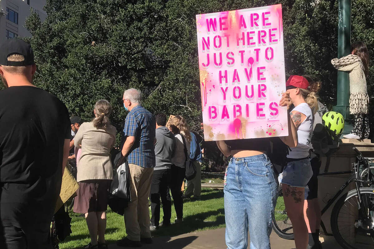 Protestors hold signs and rally in Frank Ogawa Plaza in Oakland on Friday, June 24, in response to the Supreme Court's decision overturning Roe vs. Wade.