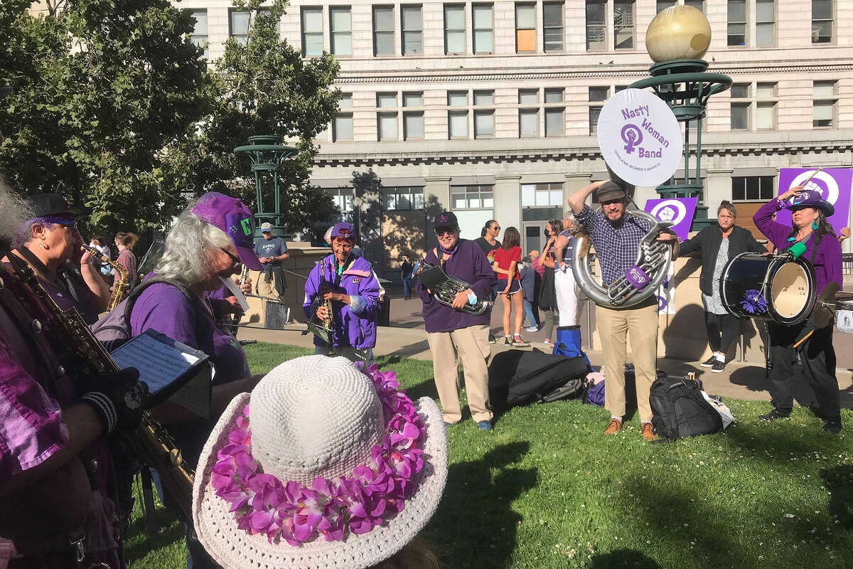 The Nasty Woman band rehearses at Frank H. Ogawa Plaza in Oakland on Friday, June 24, 2022, ahead of a march in protest of the Supreme Court's decision overturning Roe v. Wade.