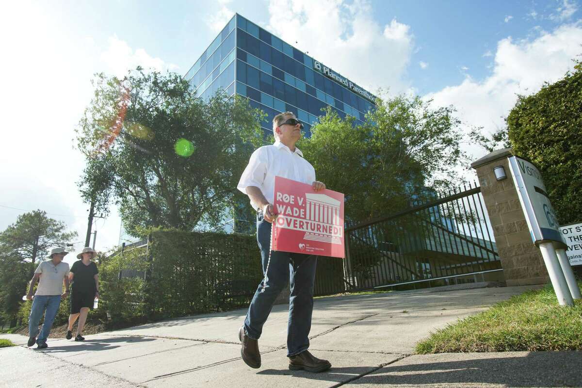Richard Lang protests Friday at Planned Parenthood in Houston.