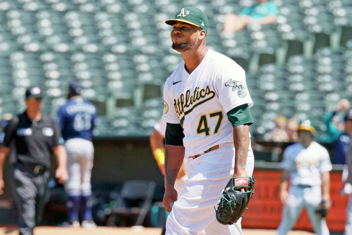 Oakland Athletics starting pitcher Frankie Montas (47) reacts after giving up his first hit in the eighth inning during an MLB game against the Seattle Mariners at RingCentral Coliseum, Thursday, June 23, 2022, in Oakland, Calif.