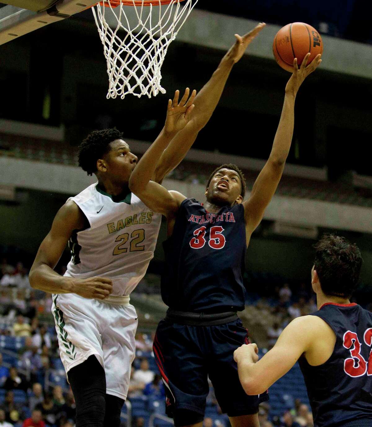 Atascocita forward Fabian White gets his shot blocked by Desoto forward Marques Bolde during the fourth quarter of a UIL Class 6A boys high school state final basketball game, Saturday, March 12, 2016, in San Antonio.