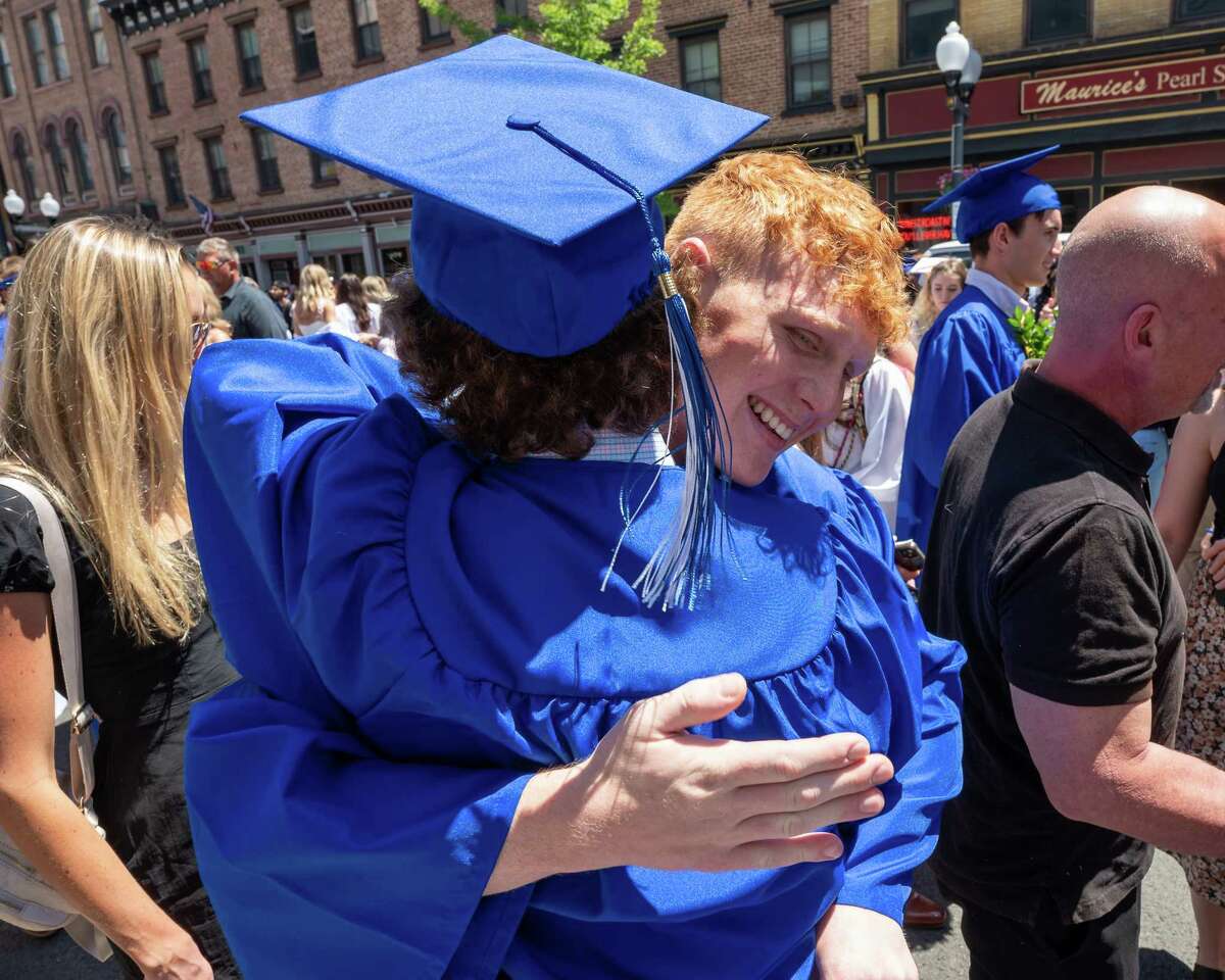 Shaker High School graduate Sam D’Angelo congratulates classmate Ryan Goronsky following the commencement ceremony at the MVP Arena in Albany, NY, on Saturday, June 25, 2022. (Jim Franco/Special to the Times Union)