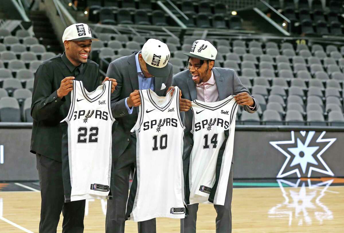 Spurs draft picks Jeremy Sochan, Malaki Branham and Blake Wesley,L to R, share a laugh as they have their photos taken with their New Jersey at AT&T Center on Saturday, June 25, 2022.