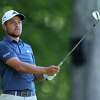 Xander Schauffele plays his shot from the 11th tee during the third round of the Travelers Championship at TPC River Highlands on Saturday in Cromwell.