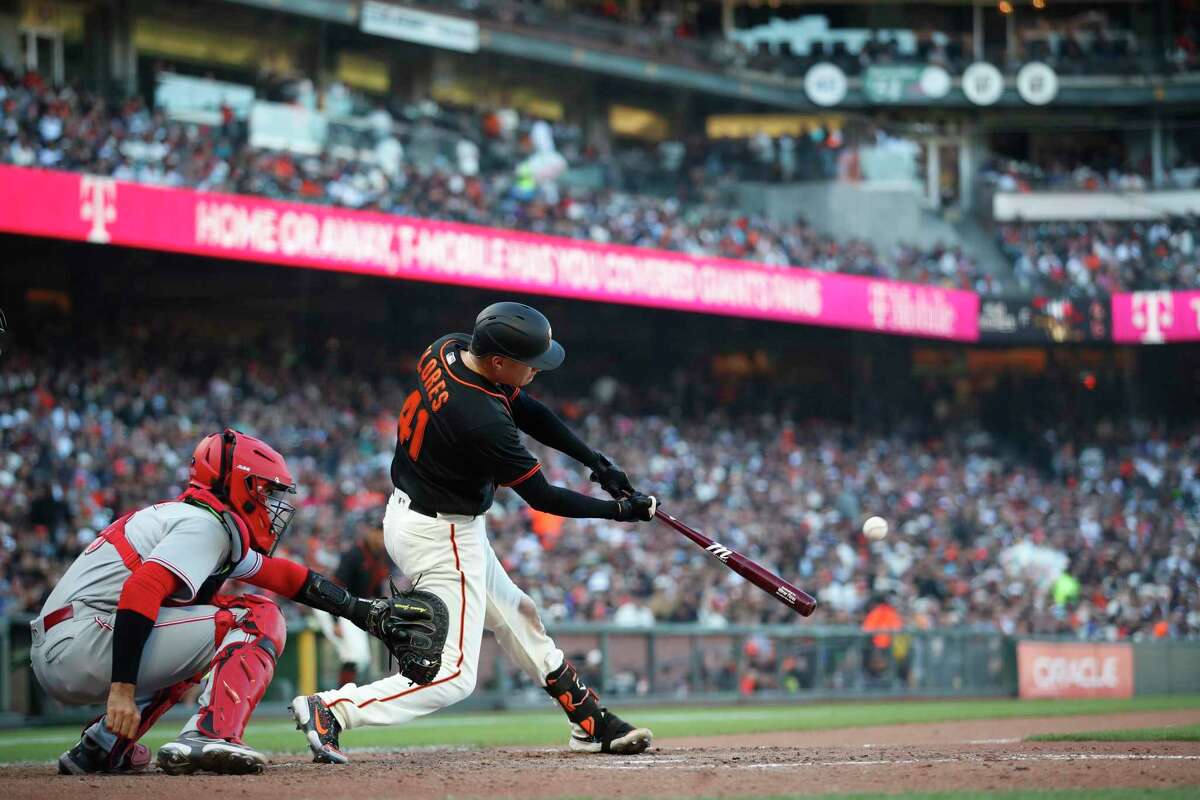 San Francisco Giants' Wilmer Flores (41) hits a three-run home run against the Cincinnati Reds during the sixth inning of a baseball game in San Francisco, Saturday, June 25, 2022. (AP Photo/Josie Lepe)