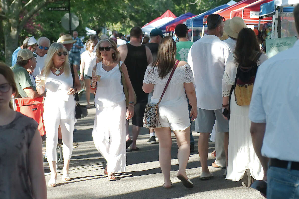 Visitors put on white and enjoyed an evening of art, history and entertainment in historic League City during the White Linen Night Art Crawl Saturday, June 25, 2022.