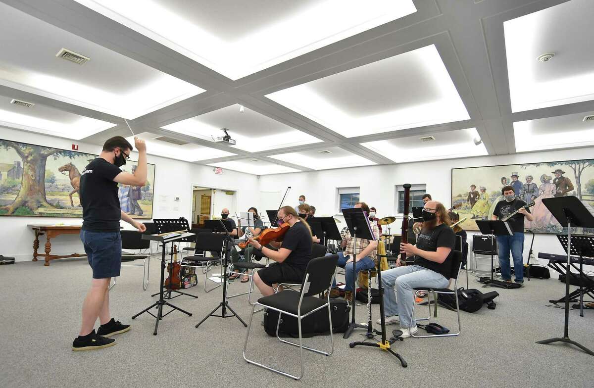 Conductor Nick Bara leads the Norwalk Gamer Symphony Orchestra (NGSO) as it rehearses for upcoming shows at New Canaan Historical Society in New Canaan, Conn., on Tuesday June 21, 2022. The orchestra, which was founded in 2016, plays music originally used in video games. On this evening, NGSO was rehearsing music from The Legend of Zelda for two upcoming shows: Aug 27th in Hartford at the Retro World Expo and Sun. Sept. 18th in Bethel at the Multivers Expo. For more info visit: www.norwalkgso.org