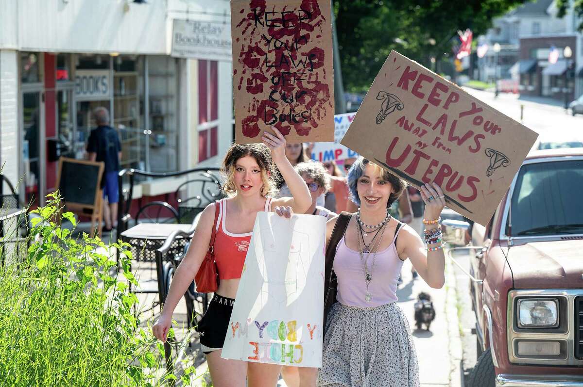 Greyson Scully and Karma Sauvageau marched on Greenwood Ave. in Bethel, CT on Saturday, June 25, 2022 to show solidarity for a woman's right to choose after the Supreme Court's decision to overturn Roe v. Wade. The event was organized by Marissa Amundsen of Molten Java.