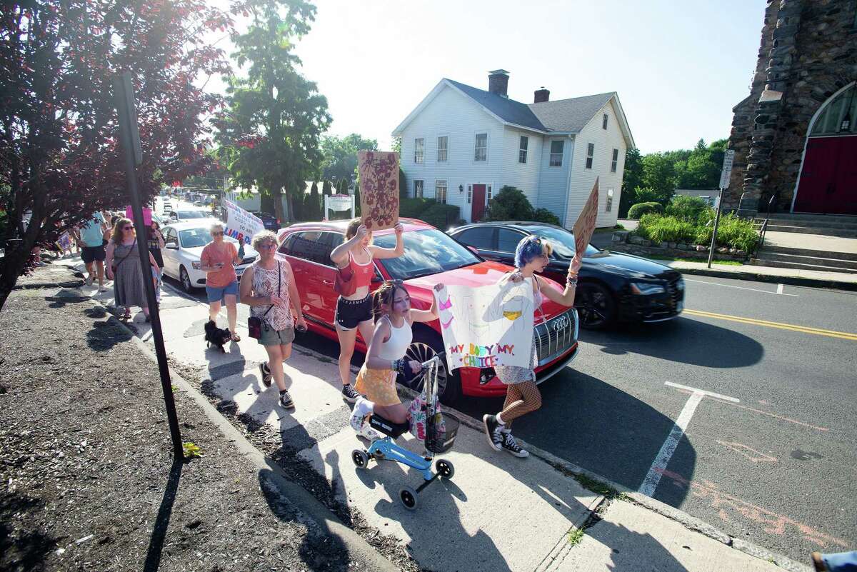 A group of around 40 people joined Marissa Amundsen of Molten Java on Saturday, June 25, in a march along Greenwood Ave. in Bethel, CT, to show solidarity after the Supreme Court's decision to overturn Roe v. Wade.