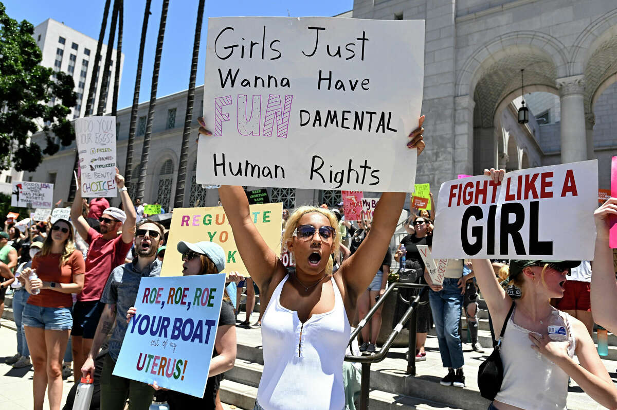 Activists rally in front of City Hall, Saturday, June 25, 2022, in Los Angeles, as they protest the Supreme Court's ruling on abortion. (Keith Birmingham/The Orange County Register via AP)