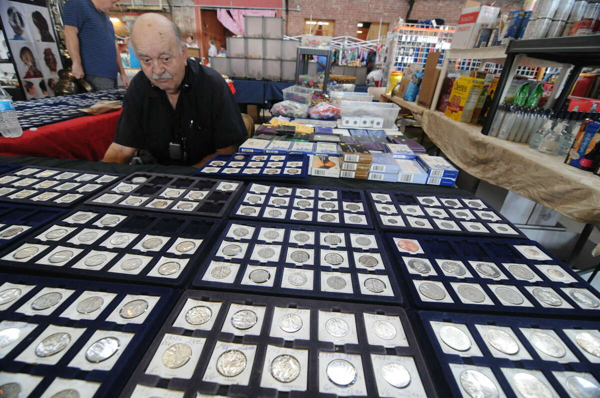 Harry Nappier of White Hall and some of the rare coins he had for sale at the Riverside Flea Market in Grafton.