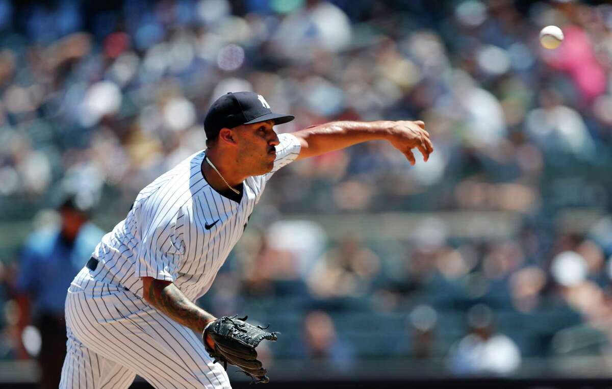New York Yankees starting pitcher Nestor Cortes throws against the Houston Astros during the first inning of a baseball game, Sunday, June 26, 2022, in New York. (AP Photo/Noah K. Murray)