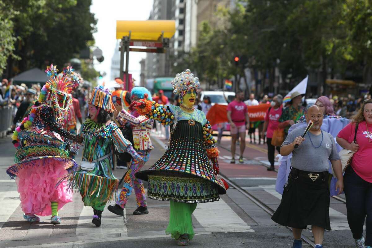 Verasphere attendees at San Francisco Pride march down the parade route on June 26, 2022.